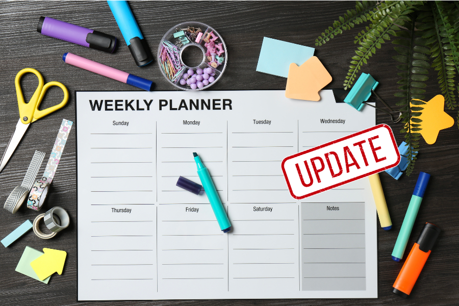 Weekly planner with stationery surrounding it. Update in red is across Wednesday